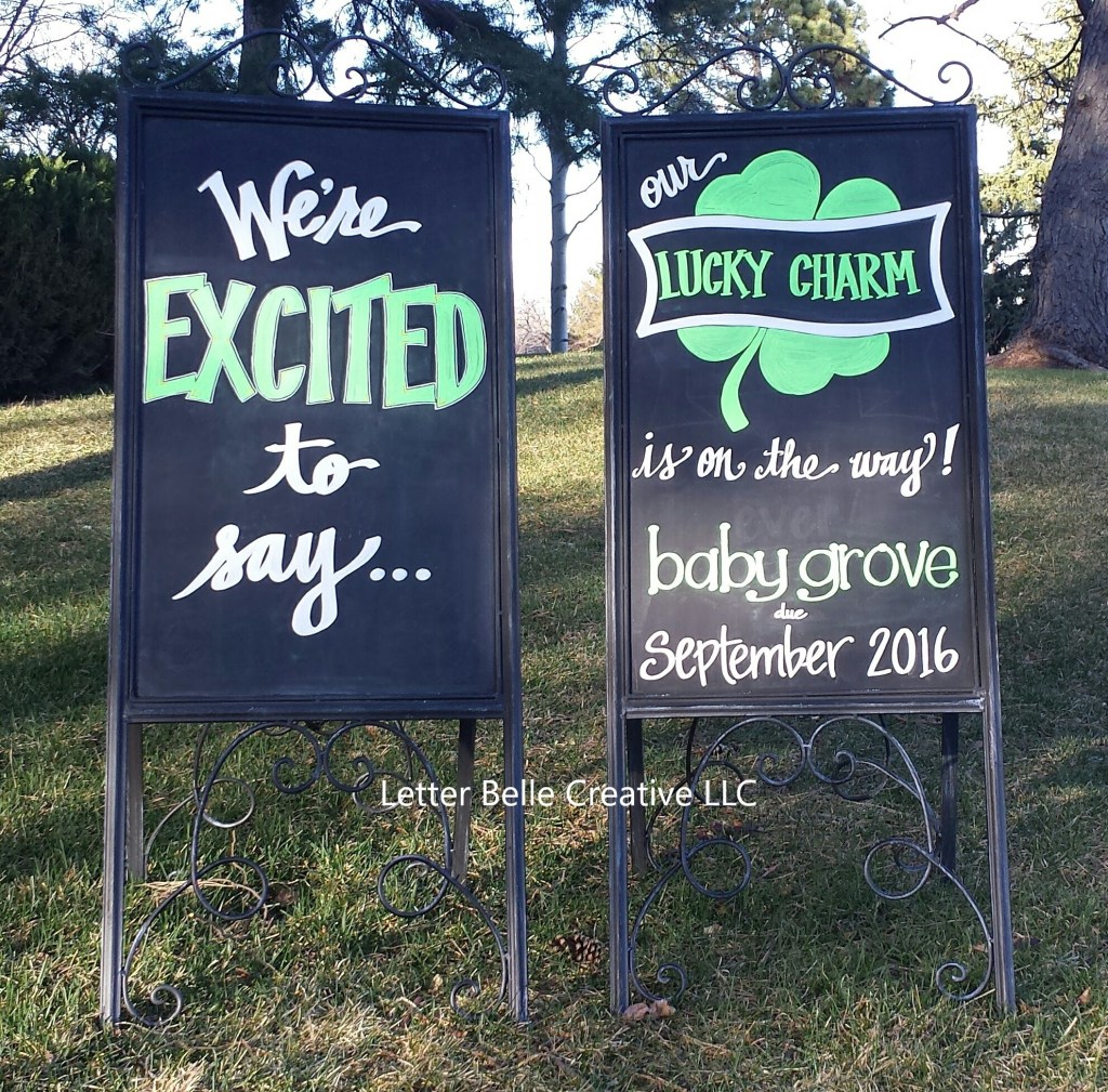 Pregnancy announcement on two black framed chalkboards: We're EXCITED to say... our LUCKY CHARM is on the way! baby grove due September 2016

Letter Belle Creative