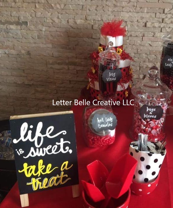 Dessert table at baby shower. Small chalkboard with white & yellow hand lettering: Life is sweet, take a treat. Candy jars with hand lettered tags

Letter Belle Creative