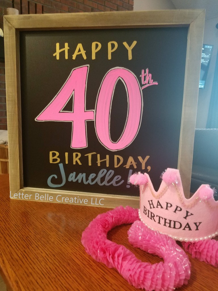 Square framed chalkboard sign with colorful hand lettering: Happy 40th birthday, Janelle!

Letter Belle Creative