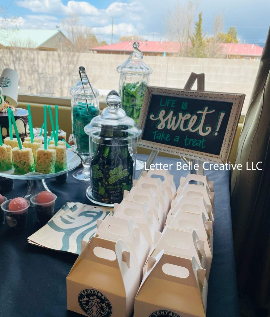 Dessert table at birthday party with white-framed chalkboard with green & white hand lettering: Life is sweet! Take a treat

Letter Belle Creative