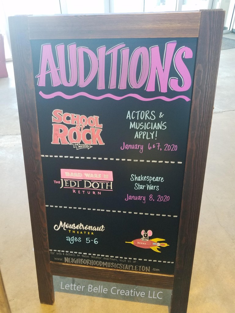 A-frame chalkboard promoting auditions for 3 different theatrical productions: School of Rock the Musical, Bard Wars III the Jedi Doth Return, and Mousetronaut Theater

Letter Belle Creative