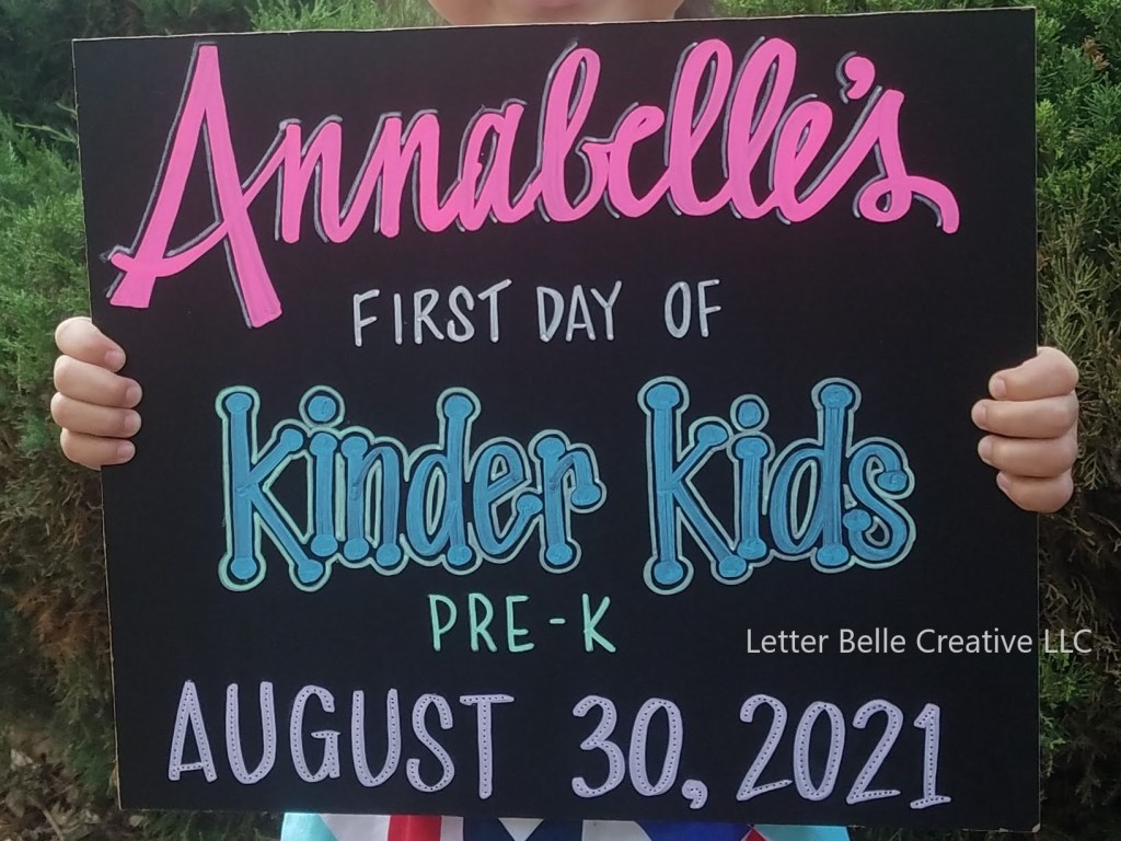 Chalkboard with colorful hand lettering for first day of school: Annabelle's first day of kinder kids pre-k. August 30, 2021

Letter Belle Creative