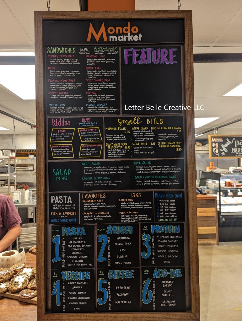 Custom-made chalkboard menu for Mondo Market at Stanley Marketplace. Individual menu tiles configured in tall rectangular frame

Letter Belle Creative