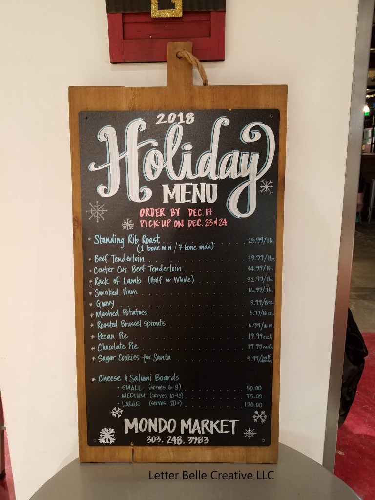 2018 Holiday ordering menu for Mondo Market. Black chalkboard on wood frame that looks like a cutting board.

Letter Belle Creative