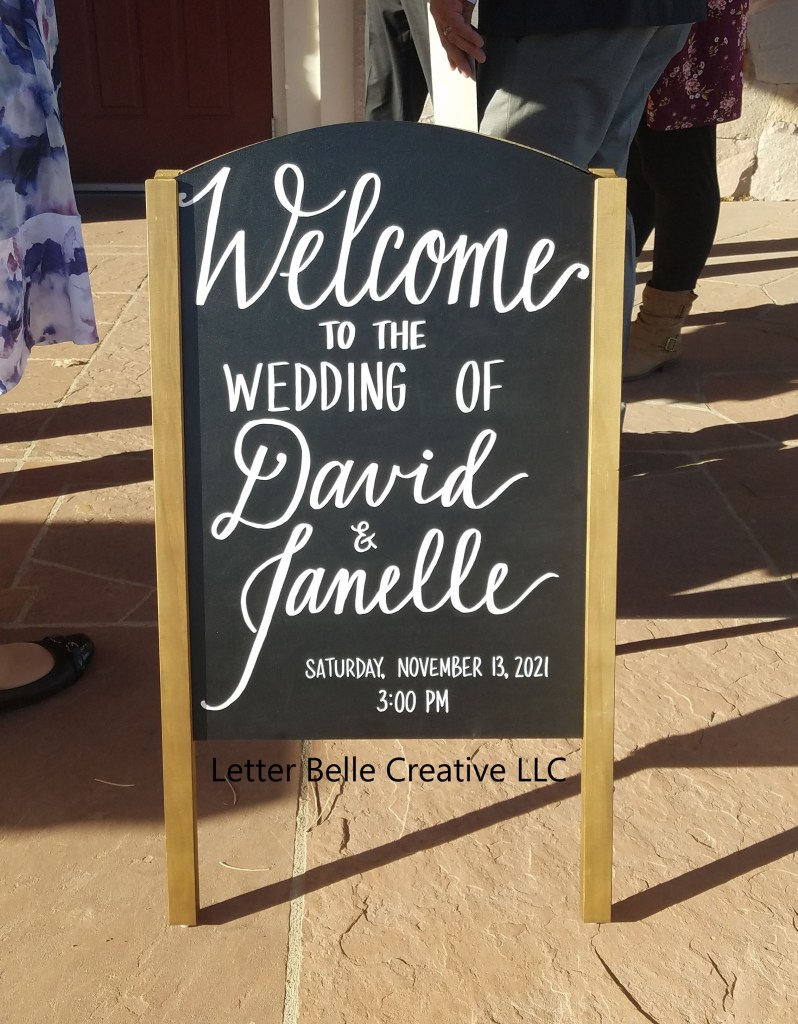Chalkboard sign with white hand lettering: Welcome to the wedding of David & Janelle

Letter Belle Creative